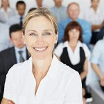 Female-Employer-with-hotel-staff-background.jpg